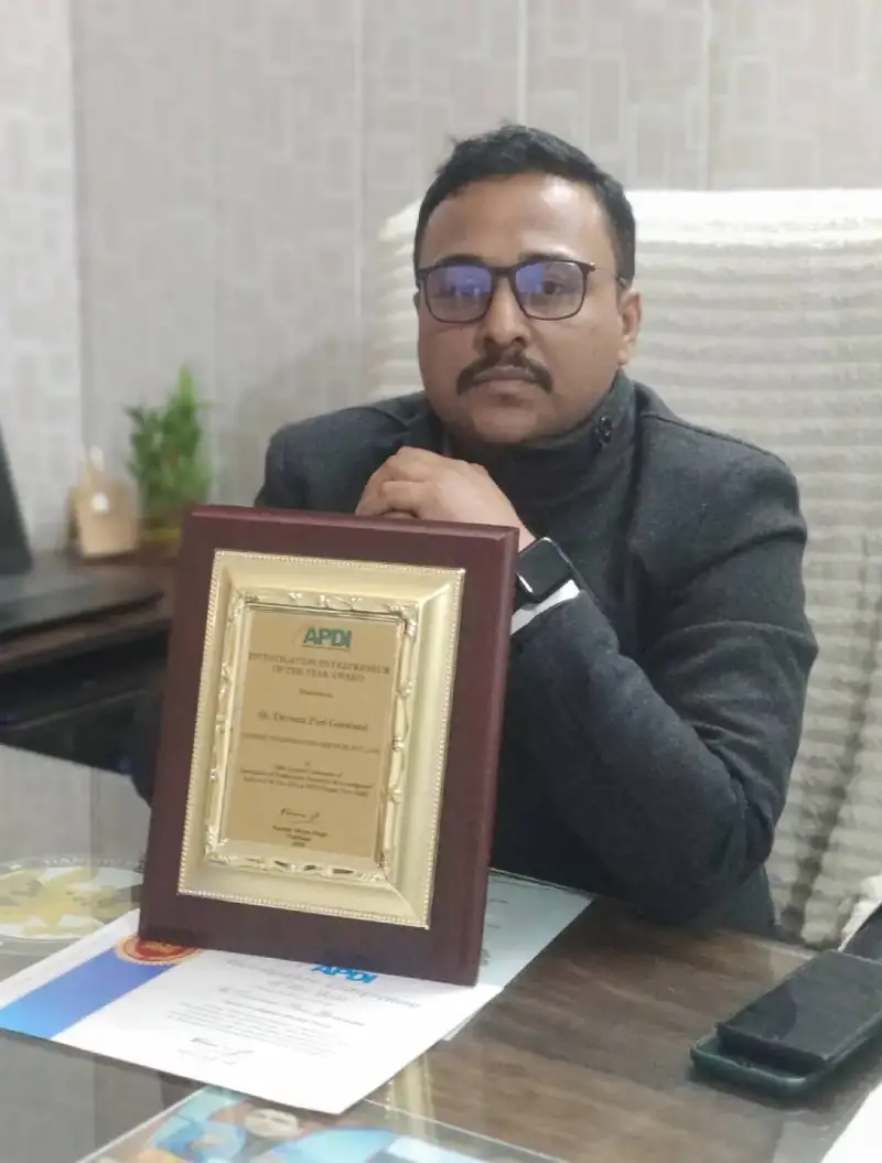 Detective in Kolkata with his Award at office.